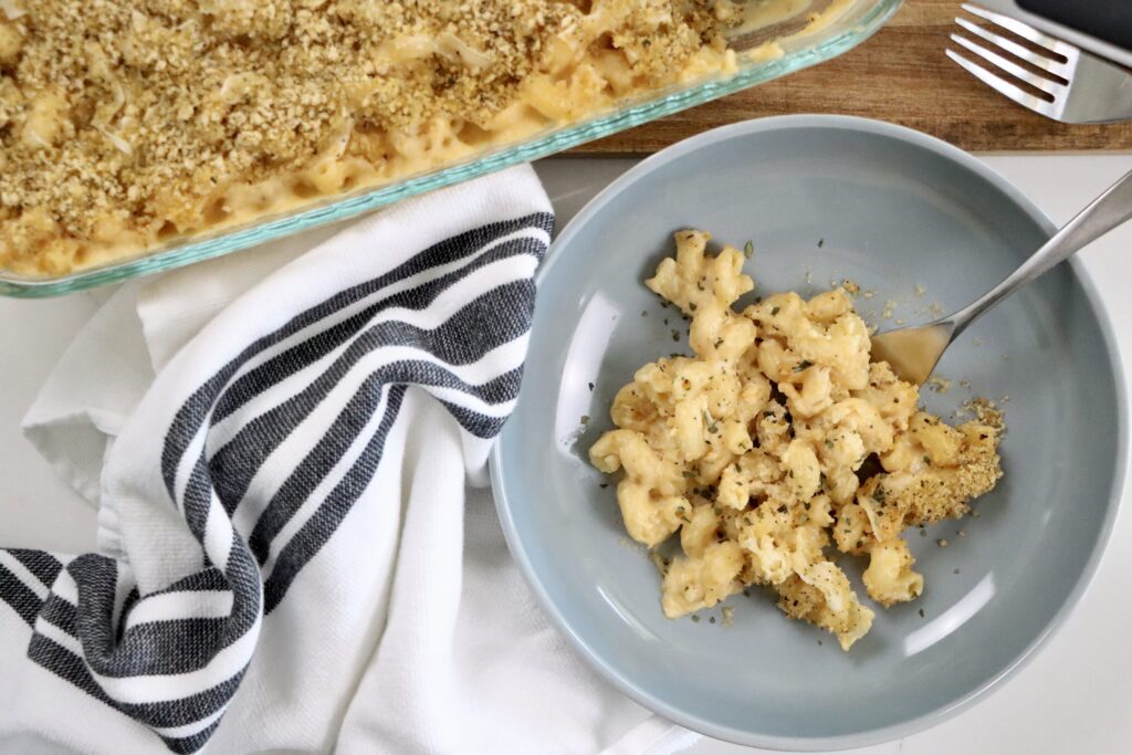 Creamy baked macaroni and cheese topped with Parmesan cheese and crispy Italian herb breadcrumbs.