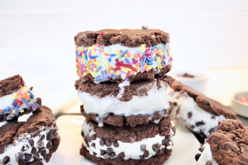 Homemade ice cream sandwiches with chocolate cookies and vanilla ice cream, perfect summer frozen dessert