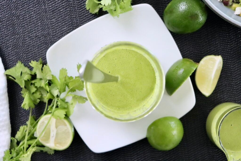 A bowl of creamy cilantro lime salad dressing made with fresh cilantro, lime juice, and Greek yogurt.