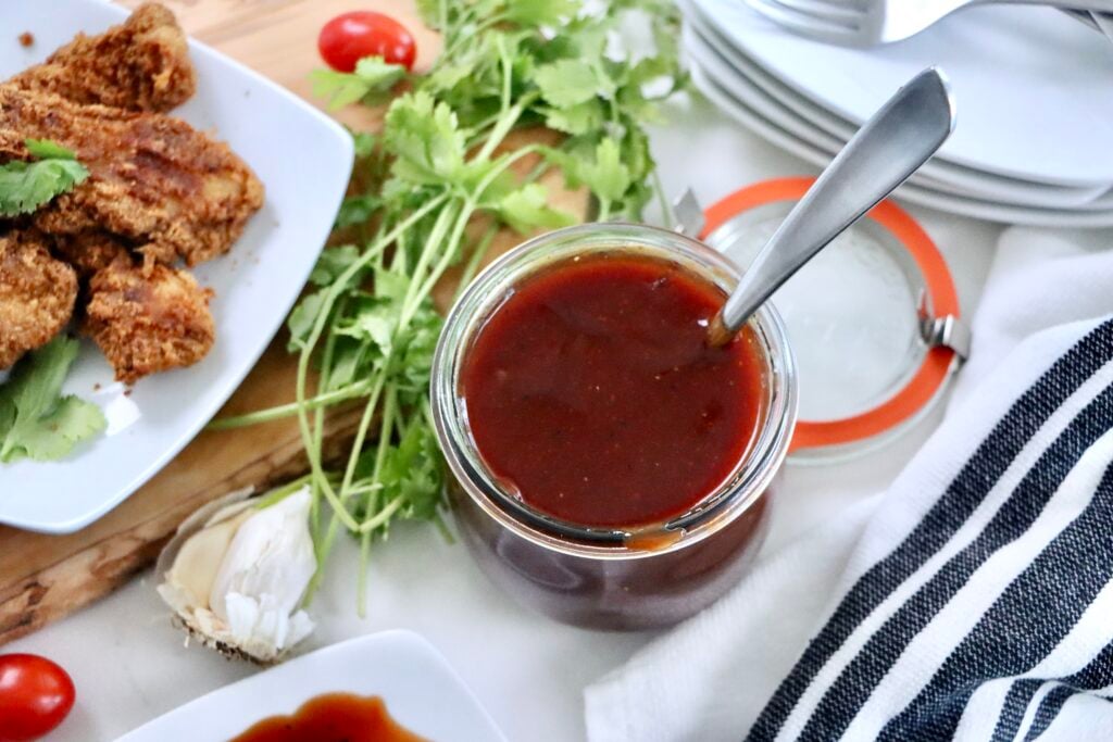 Sweet and tangy homemade barbecue sauce in a mason jar, made from scratch with simple pantry ingredients.