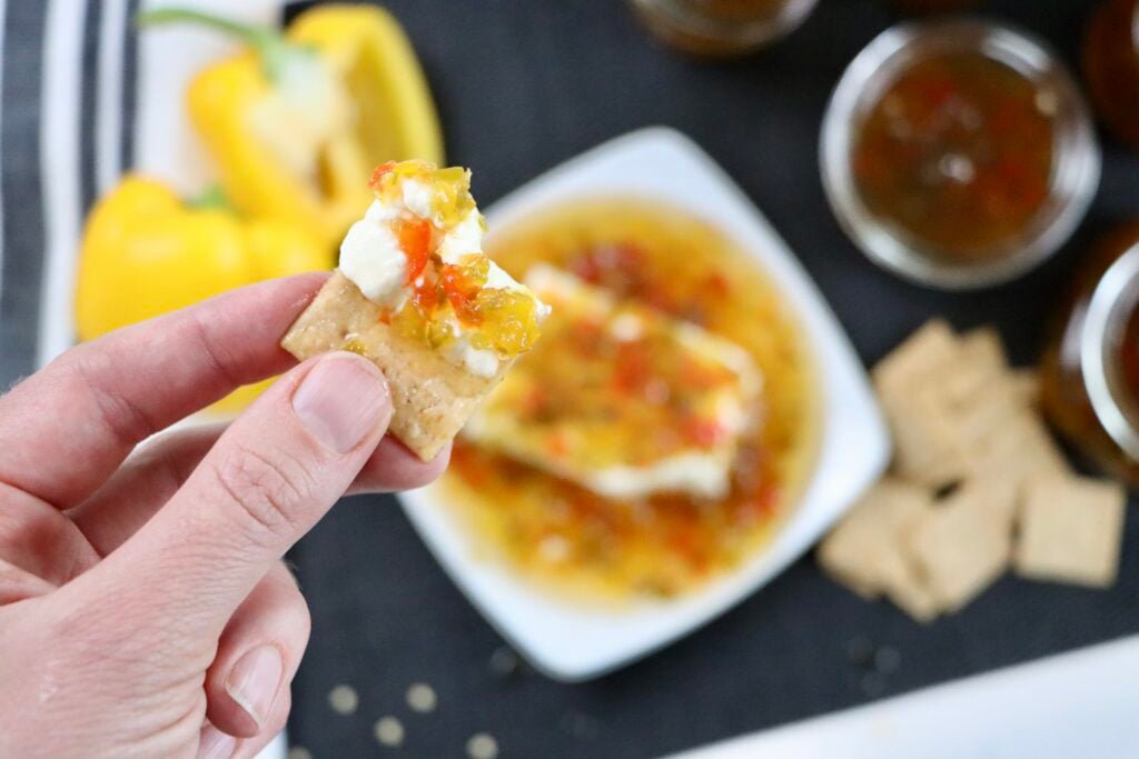 Homemade jalapeño pepper jelly served with cream cheese, crackers, for an easy appetizer.