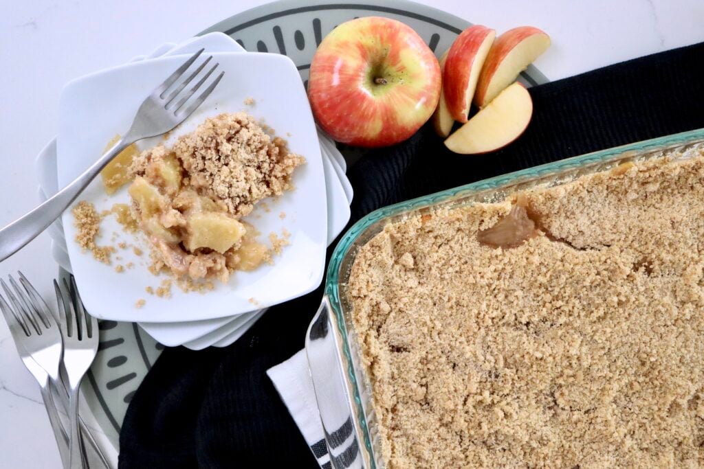 Golden-brown crumble topping on a fresh apple crisp
