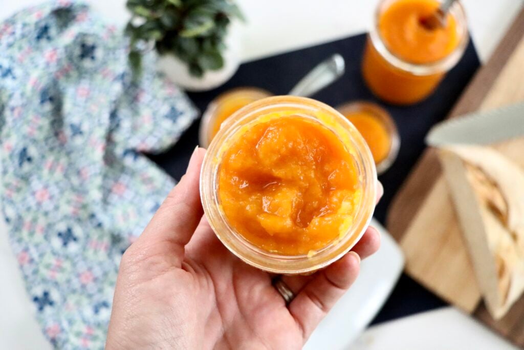 Close Up of a Glass jar of homemade apricot pineapple jam