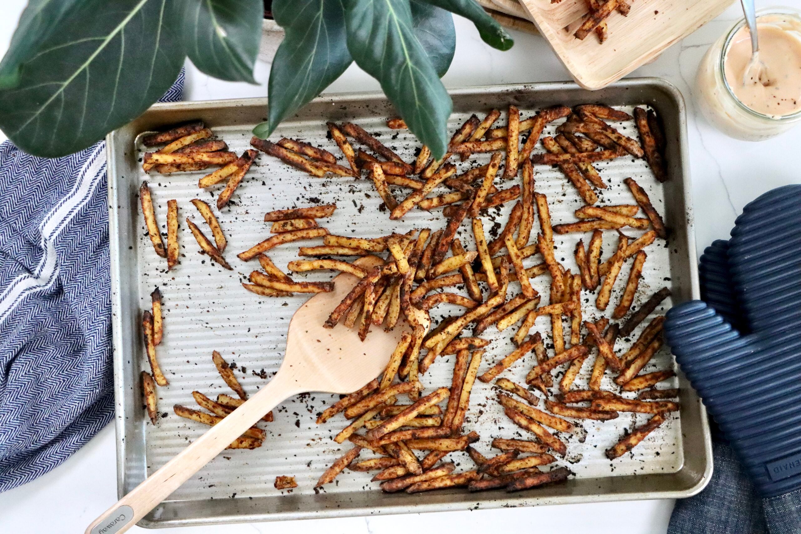 Yellow potato fries seasoned with chili powder and paprika, baked until crispy
