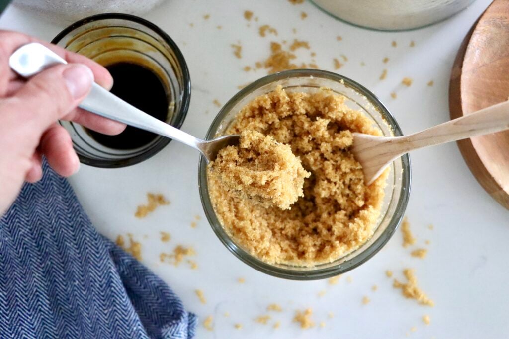 Bowl of fluffy homemade brown sugar made with sugar and molasses