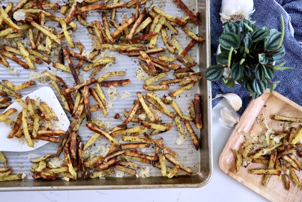 Overhead shot of crispy garlic parmesan fries fresh out of the oven