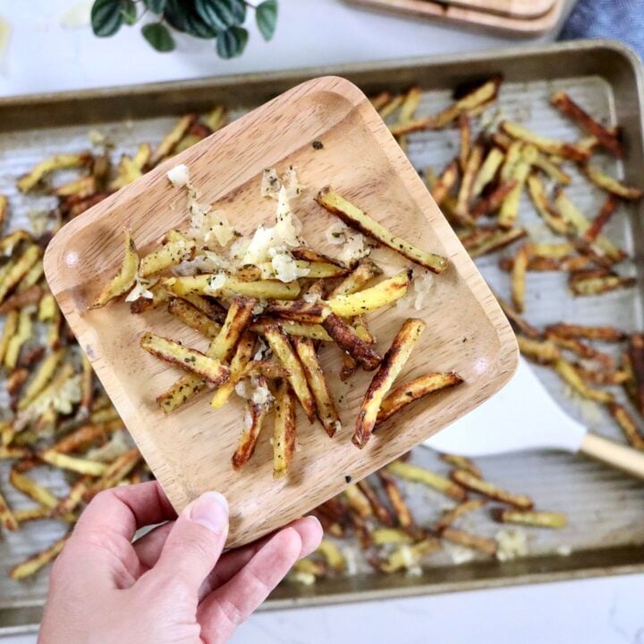 Close-up of oven-baked garlic parmesan fries with golden crispy edges