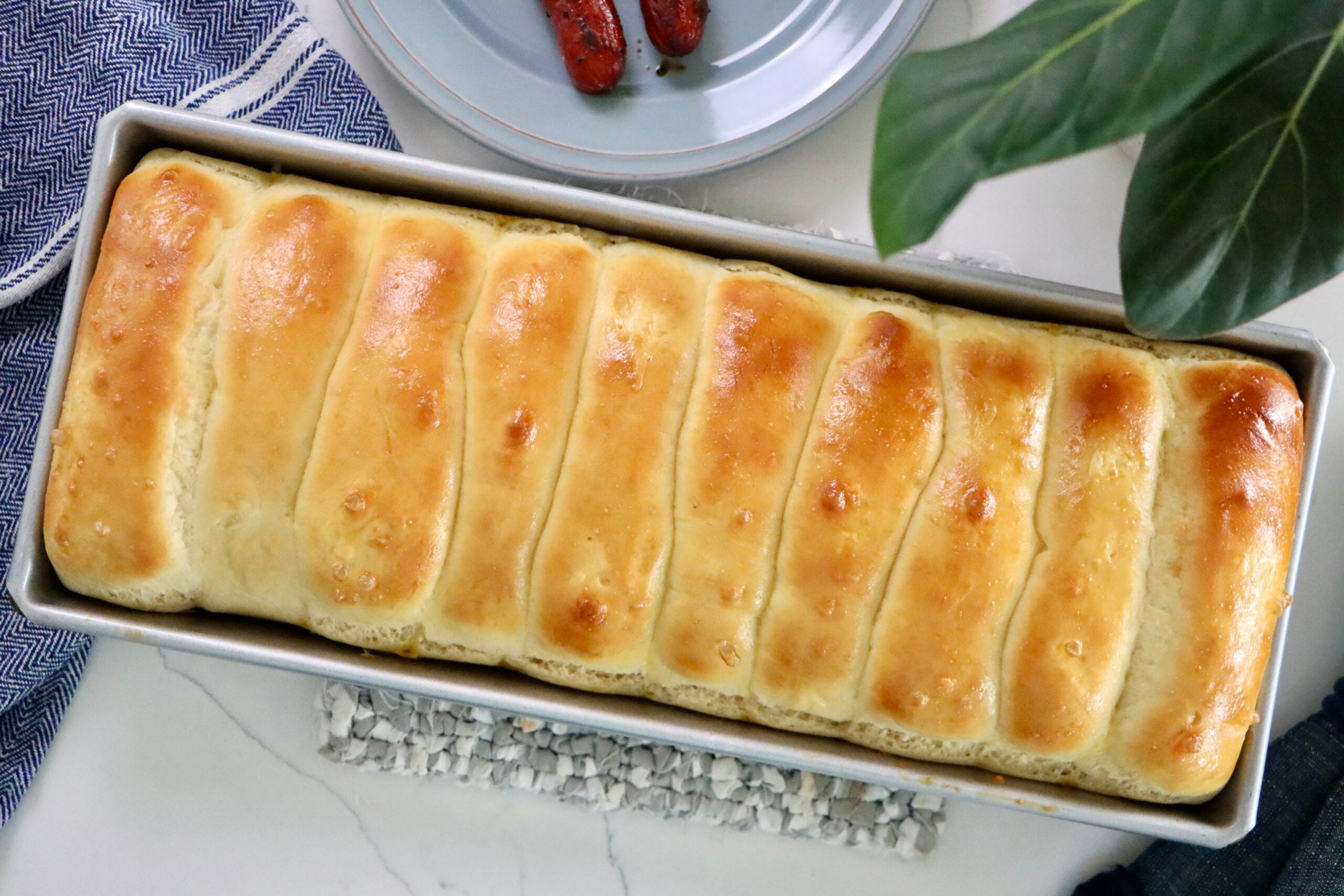 Soft and fluffy homemade quick hot dog buns baked until golden brown and ready for your next BBQ.