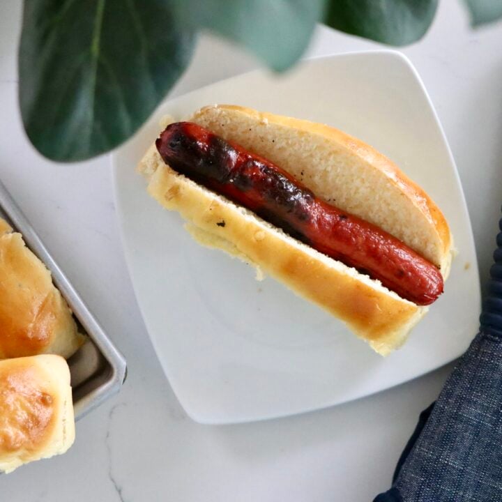 Fresh homemade hot dog buns made from scratch with simple ingredients and baked to a golden finish.