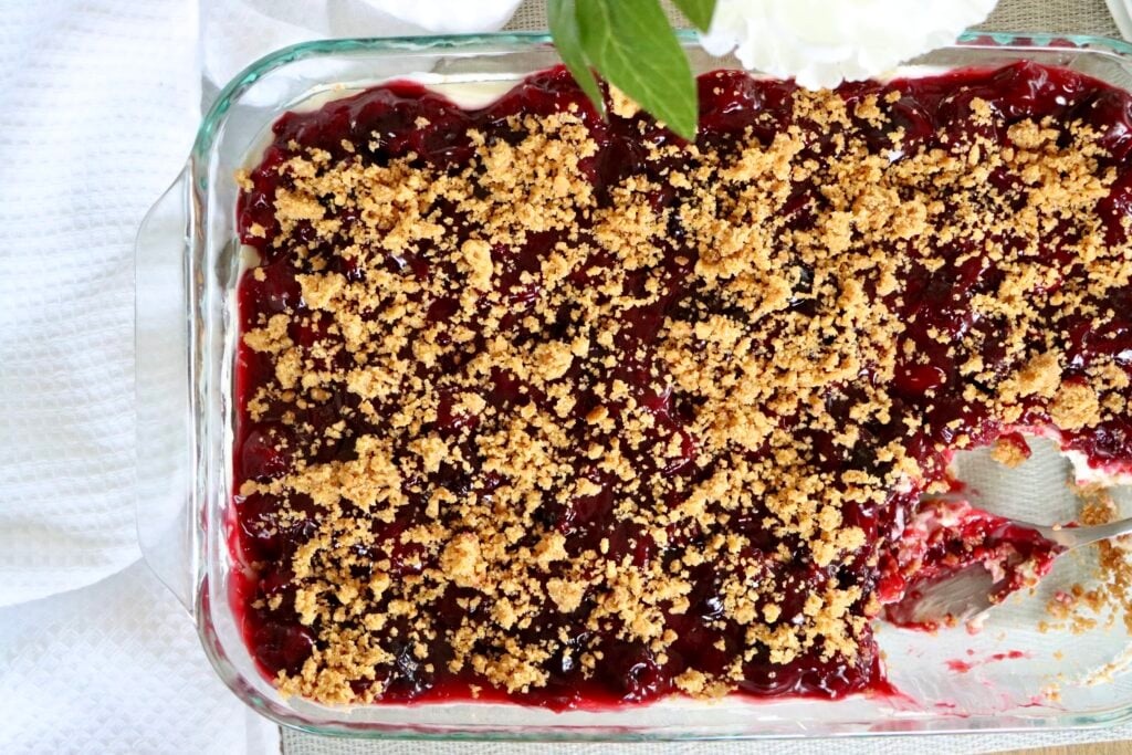 Overhead view of cherry yum yum inside a 9x13 glass baking dish