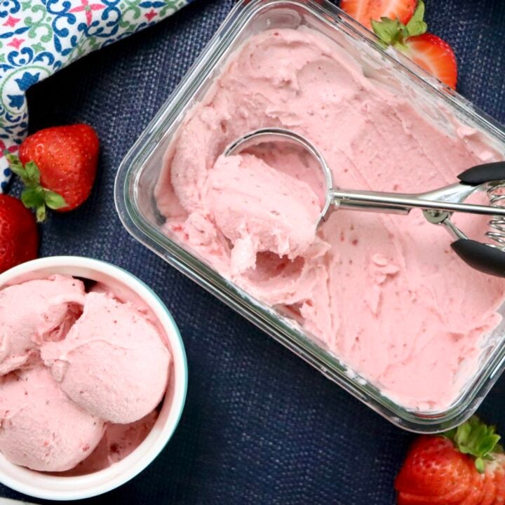 Close-up of creamy strawberry ice cream texture with visible berry pieces