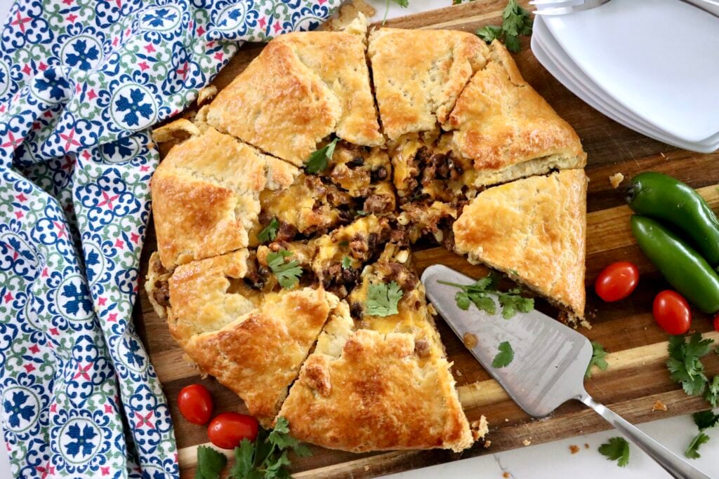 Taco galette filled with ground beef, corn, black beans, and cheddar cheese