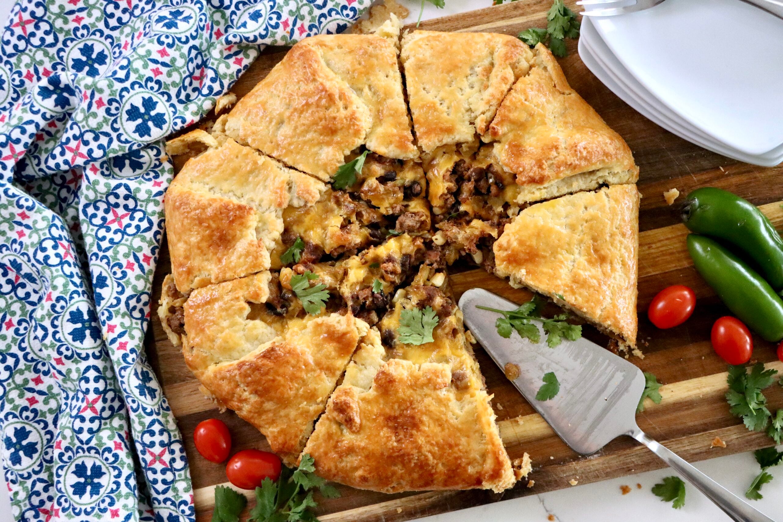 Taco galette filled with ground beef, corn, black beans, and cheddar cheese
