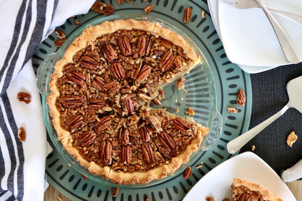 Overhead view of whole maple pecan pie topped with pecans