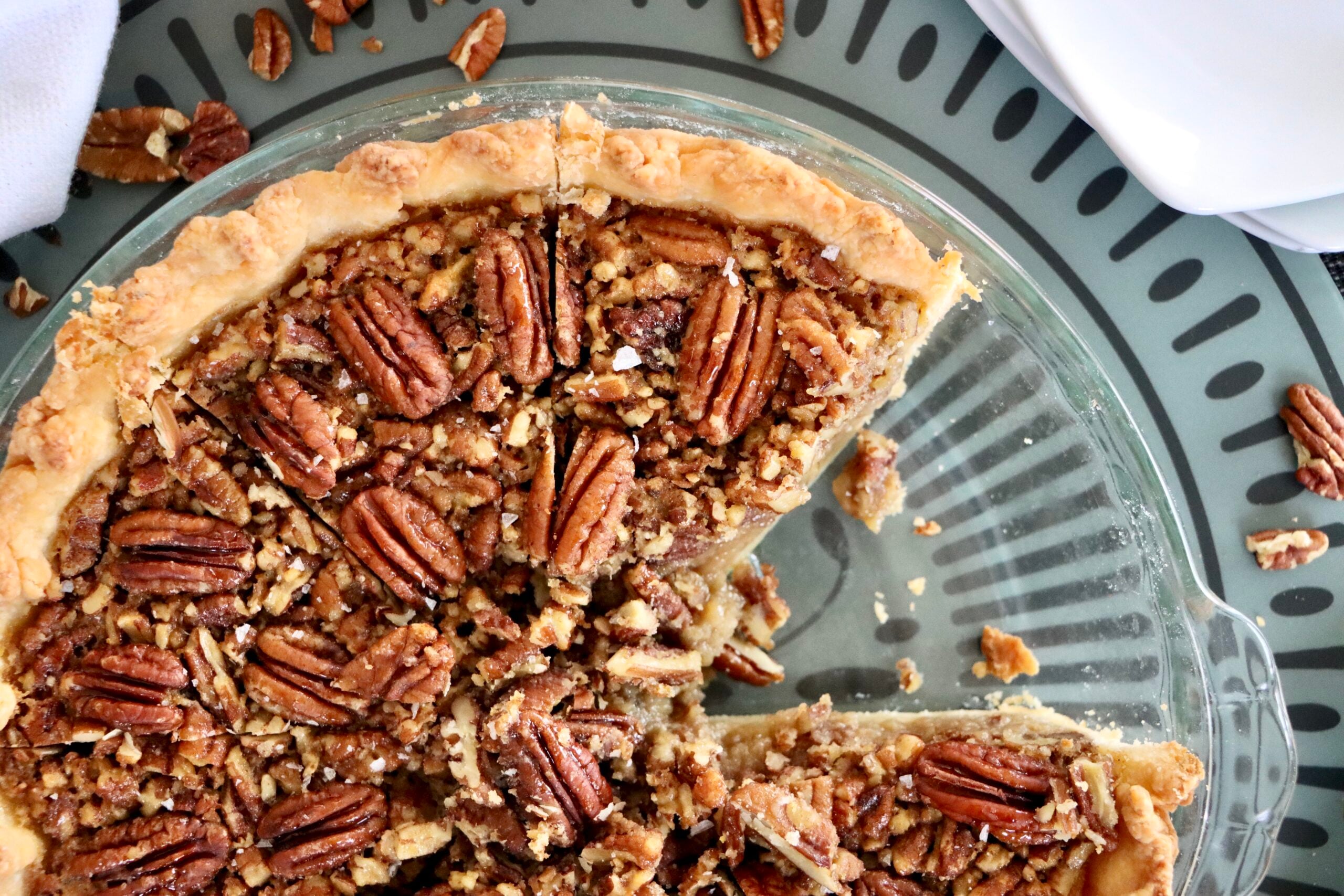 Close up of the Overhead view of whole maple pecan pie topped with pecans