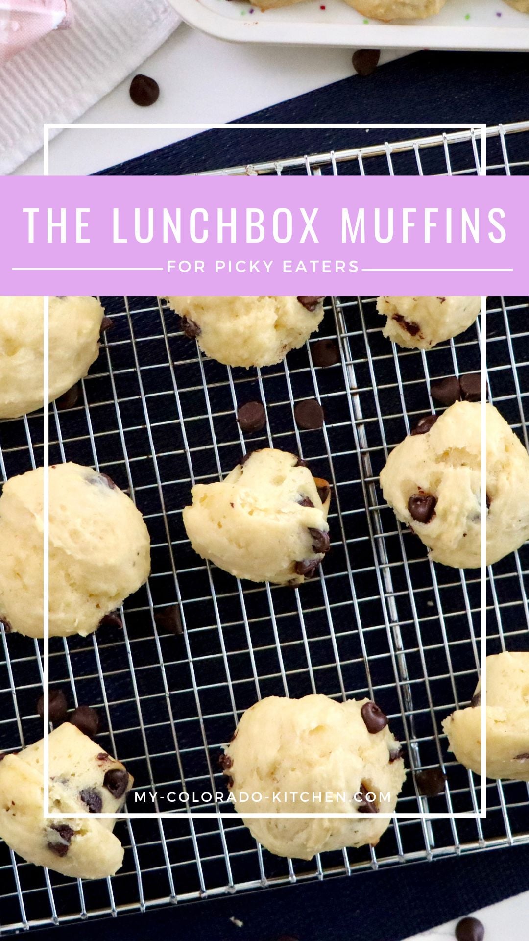 Mini chocolate chip muffins with domed bakery-style tops cooling on a wire rack