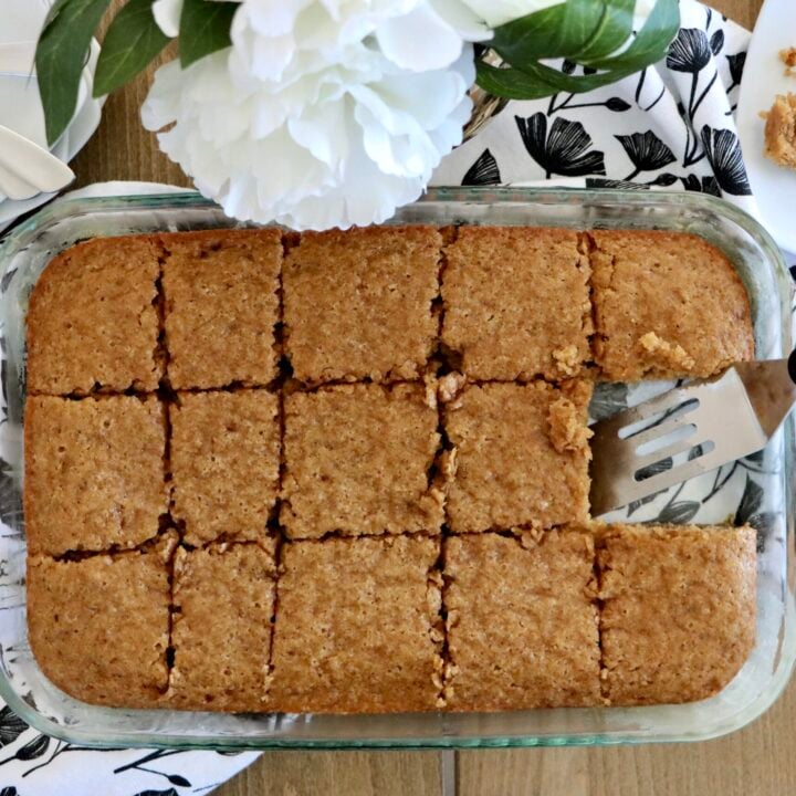 Overhead view of a 9x13 spice cake fresh out of the oven, cut into squares